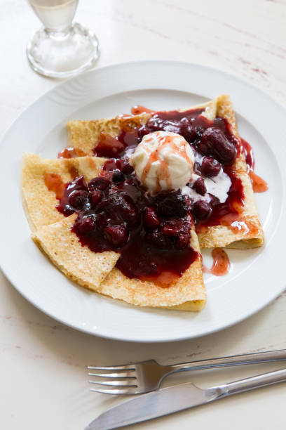 istock Freshly baked pancakes crepe served with berries 1365380093