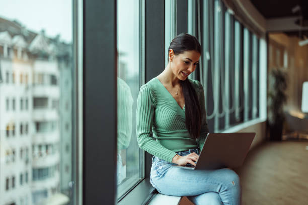 istock Concentrated caucasian woman, interviewing a potential recuit online. 1365381620