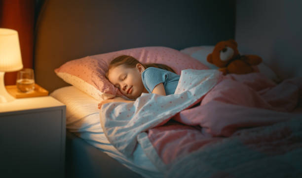 istock child is sleeping in the bed 1365382008