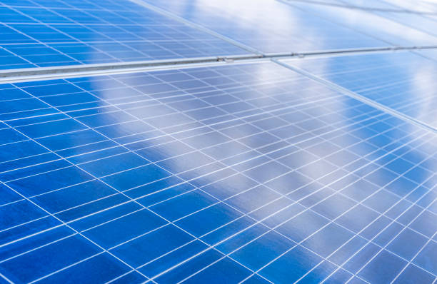 istock Close-up of solar panel with reflections of the sky and clouds 1365383655