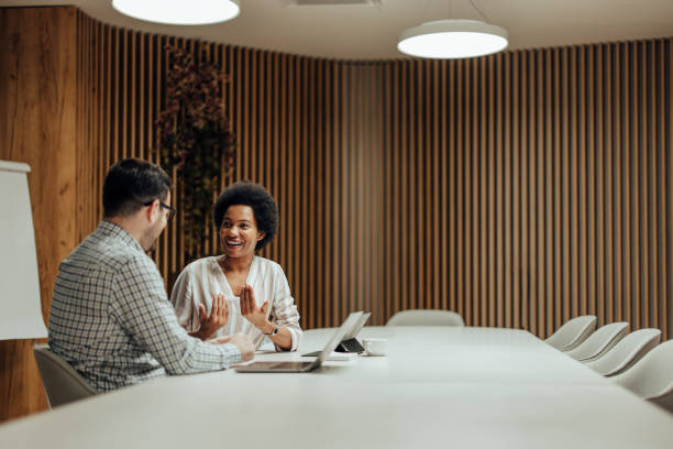 istock Confident business partners, discussing about potential investor. 1365383705