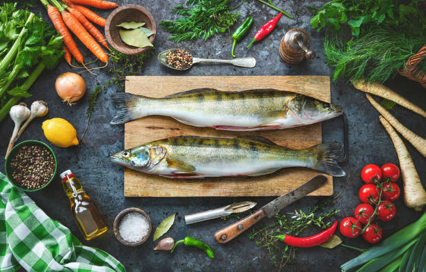 istock Fresh raw pike perches or zander and ingredients prepared for cooking 1365384747