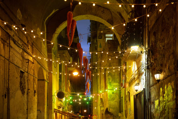 istock Italian street at night illuminated 1365387177