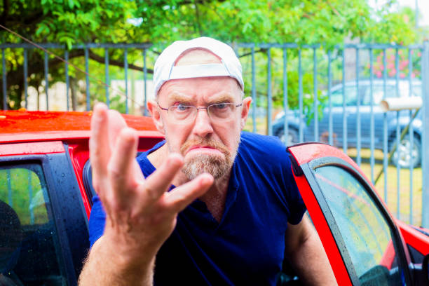 An angry motorist gets out of his car in rage at another motorist