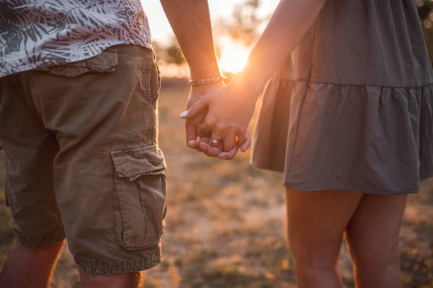 istock Couple in love holding hands 1365391930