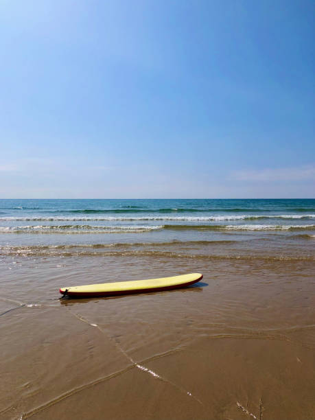 istock Surfing at Watergate Bay Beach 1365396839
