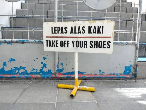 Photo of warning signs with lettering Indonesian 