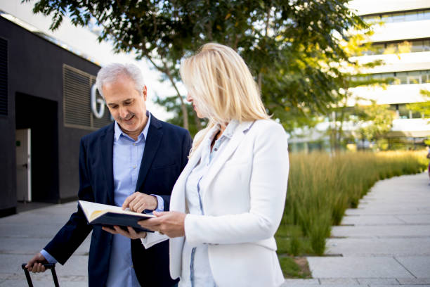 istock Two senior businessmen considering a business plan 1365400362