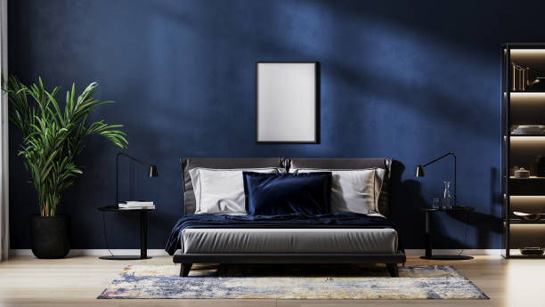 istock poster frame mock up in modern bedroom interior background with empty dark blue wall, 3d rendering 1365402473