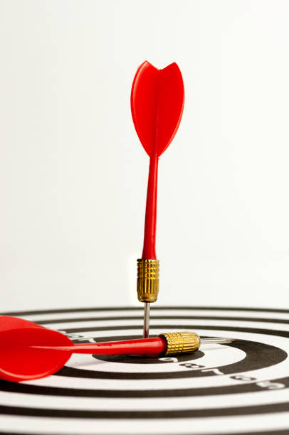 istock Red arrow hit on target dart board, business strategy planning to success goal. 1365403407