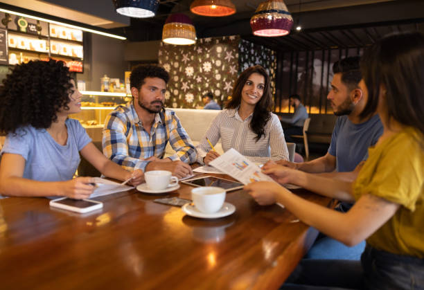 istock Group of workers in a business meeting at a restaurant 1365405001