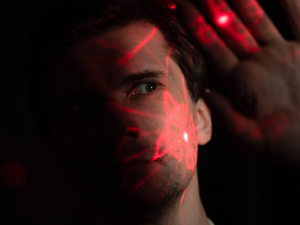 istock Modern technologies and human. young man with projection of red lines 1365407591