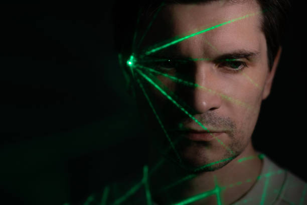 istock idea came, concept. A young man with a projection of a green flash on his face, 1365407617