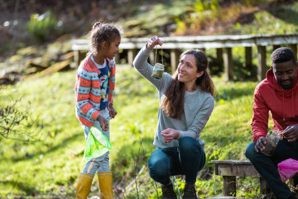 istock Pond Fishing with Mummy and Daddy 1365408099