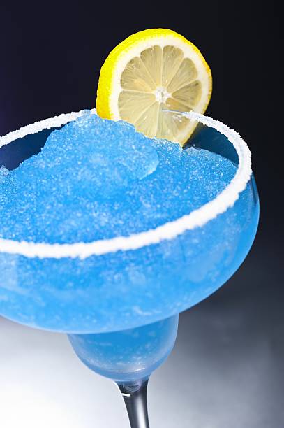 istock Blue margarita Cocktail in front of different colored backgrounds 136540820