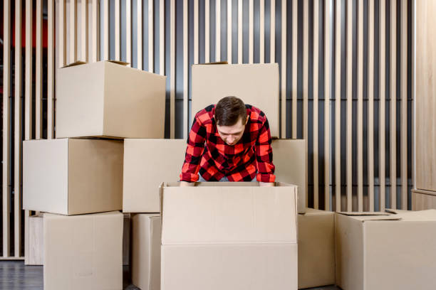 istock Young man opened the shipped box. 1365408278