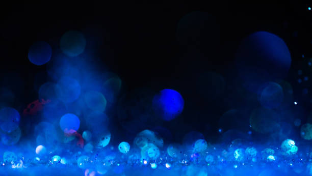istock background of abstract  blue  glitter lights 1365409709