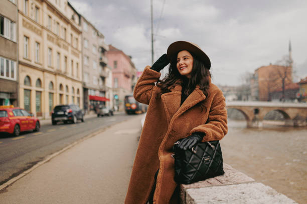 istock A smiling young woman at the downtown district 1365410309