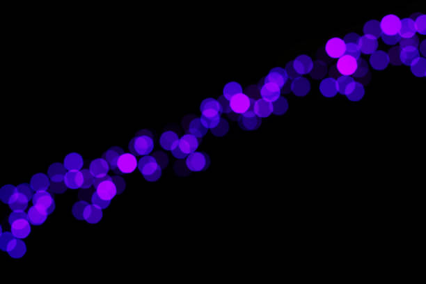 Violet and blue bokeh sparkling lights abstract background