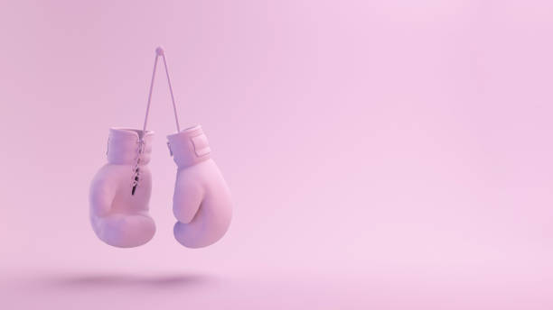розовые боксерские перчатки серии - boxing glove sports glove hanging combative sport стоковые фото и изображения