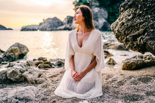 istock Woman by the sea 1365410788
