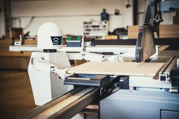 a robot works fully automatically in a carpentry workshop - automatically imagens e fotografias de stock