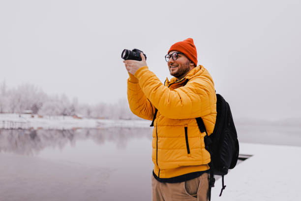 istock Traveler taking a photos by his camera 1365412112