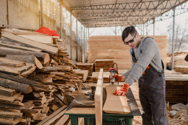 istock Young man carpenter at the wooden workshop 1365412294