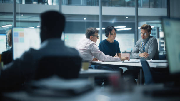 istock Diverse Team of Managers Working and Having Discussions in Modern Big City Office. Colleagues Work on New Business Opportunities, Management Board Having a Meeting, Talking About Investing in Future. 1365412628