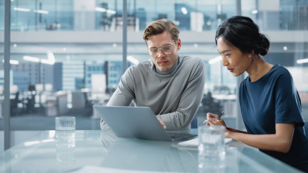 istock Multiethnic Diverse Office Conference Room Meeting: Team of Two Creative Entrepreneurs Talk, Discuss Growth Strategy. Stylish Young Businesspeople work on Investment and Marketing Projects. 1365412633