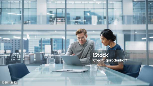 Multiethnic Diverse Office Conference Room Meeting Team Of Two Creative Entrepreneurs Talk Discuss Growth Strategy Stylish Young Businesspeople Work On Investment And Marketing Projects Stock Photo - Download Image Now