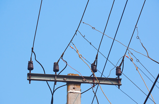 High voltage electrical power line against blue sky in the evening in Newport News, Virginia.