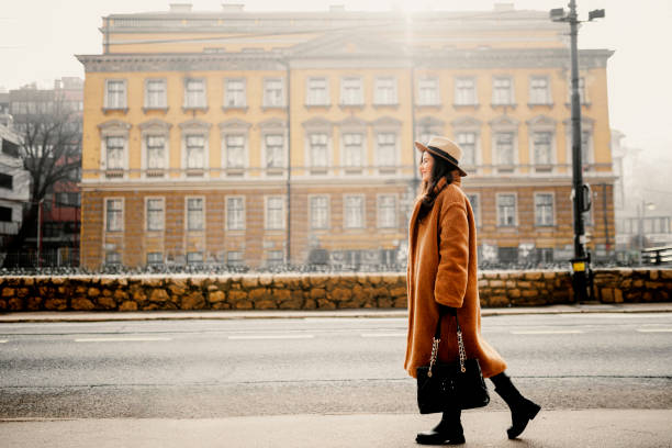 istock A smiling young woman at the downtown district 1365413277
