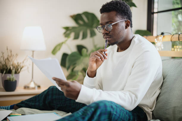 Pensive young man looking at the practice test score