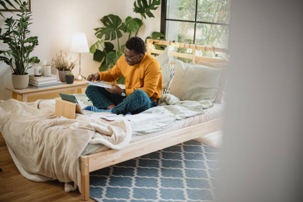 istock Young man preparing for university session, exams 1365414891