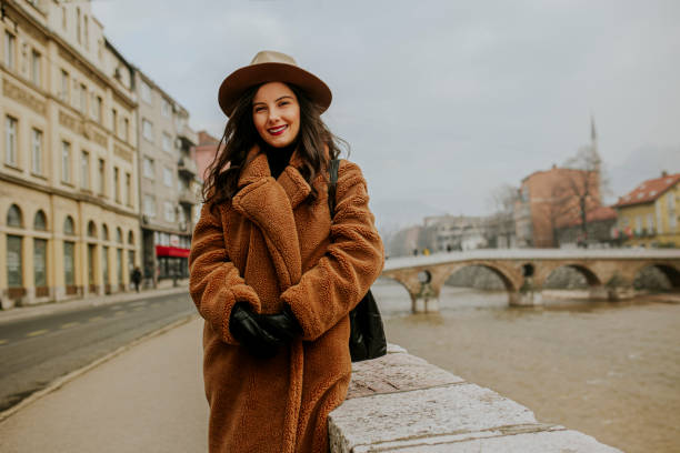 istock A smiling young woman at the downtown district 1365416272