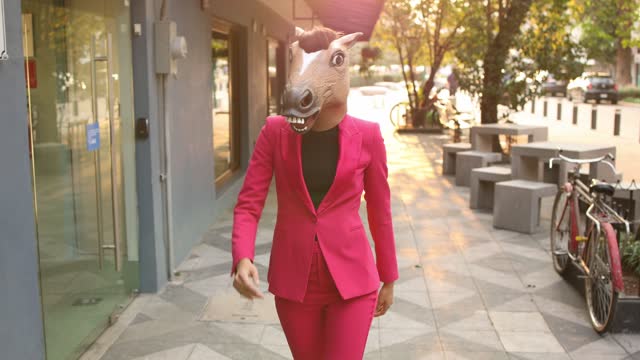 Woman with the horse head walking