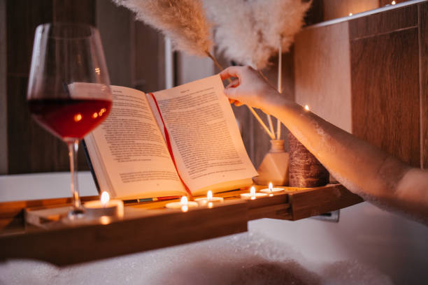 istock Reading a book in a bathtub 1365420106