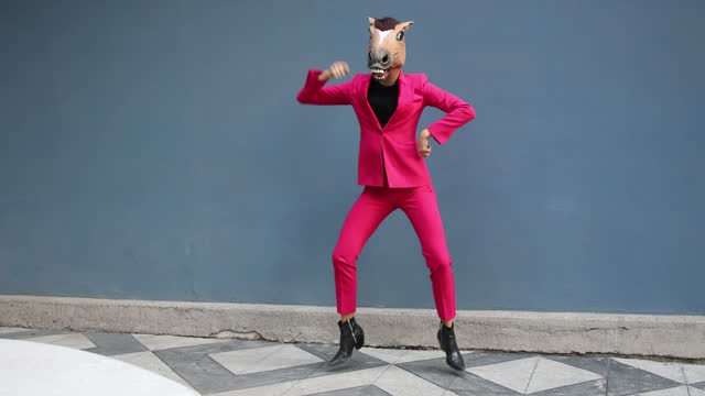 Woman with the horse head dancing