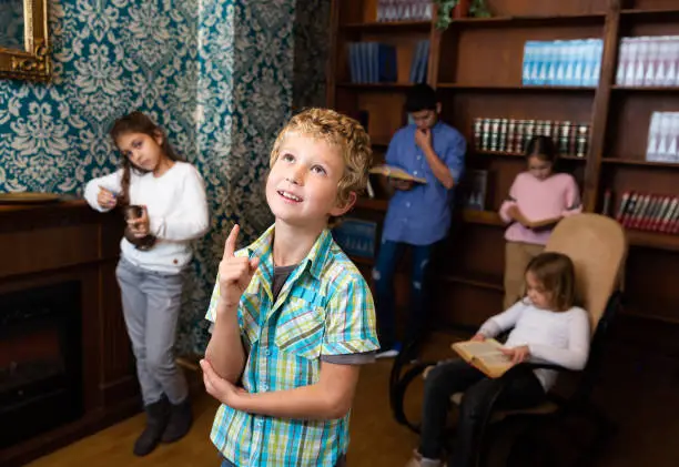 Photo of Boy are thinking about solving a problem in quest room