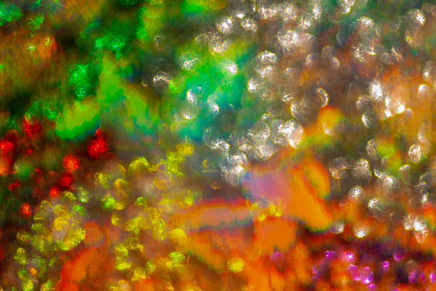 Image of the reflecting surface of shiny object illuminated with sun light. Abstract spectrum background