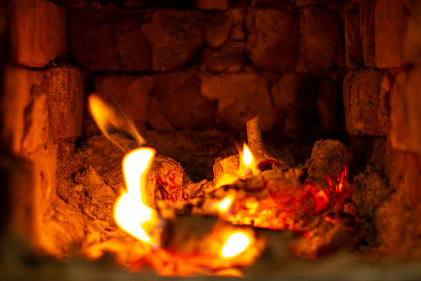 istock Beautiful small fire in the stove or fireplace close-up 1365424884