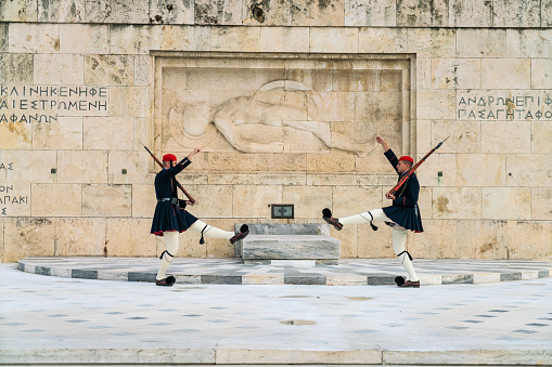 Athens, Greece - November 1, 2019: Evzones in front of the Tomb of the Unknown Soldier. The Evzones are Presidential Guard and guard the Tomb of the Unknown Soldier in Athens, Greece.