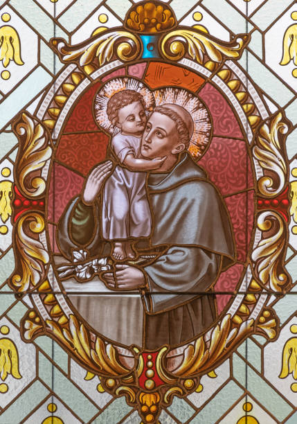 Vienna - The  St. Anthony of Padua on the stained glass of church  Alserkirche Vienna - The  St. Anthony of Padua on the stained glass of church  Alserkirche  by Franz Gotzer from 19. cent. st anthony of padua stock pictures, royalty-free photos & images