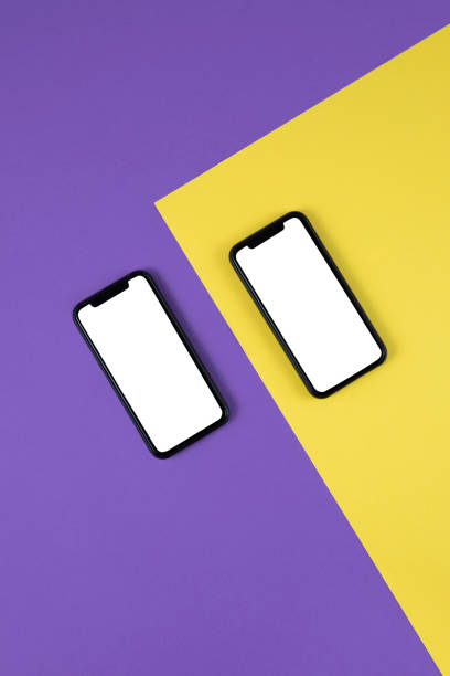 istock Mobile Phones on Two Toned Colored Background 1365429360