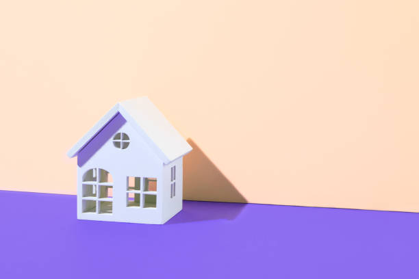 istock Wooden Home Model on Two Toned Background 1365429403