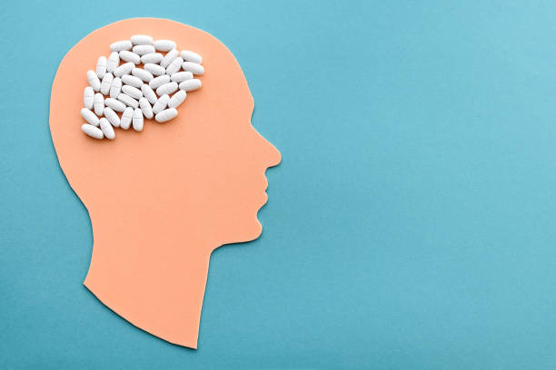 istock head with pills in the form of an abstract brain. 1365431859