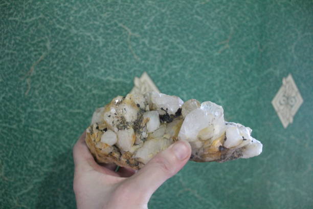 istock close-up of natural unprocessed rock crystal in a woman's hand 1365433862