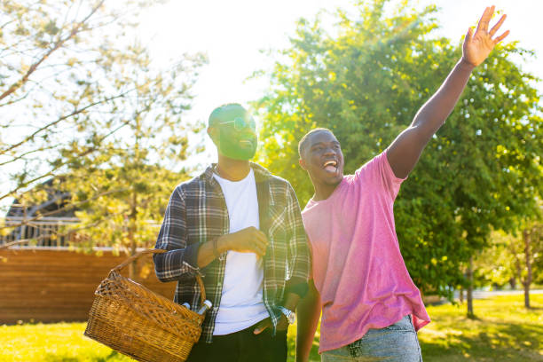 istock african american brothers spending summer holiday in sunny park 1365435607