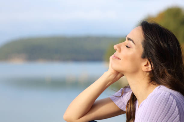 istock Happy woman relaxing in a lake 1365436629